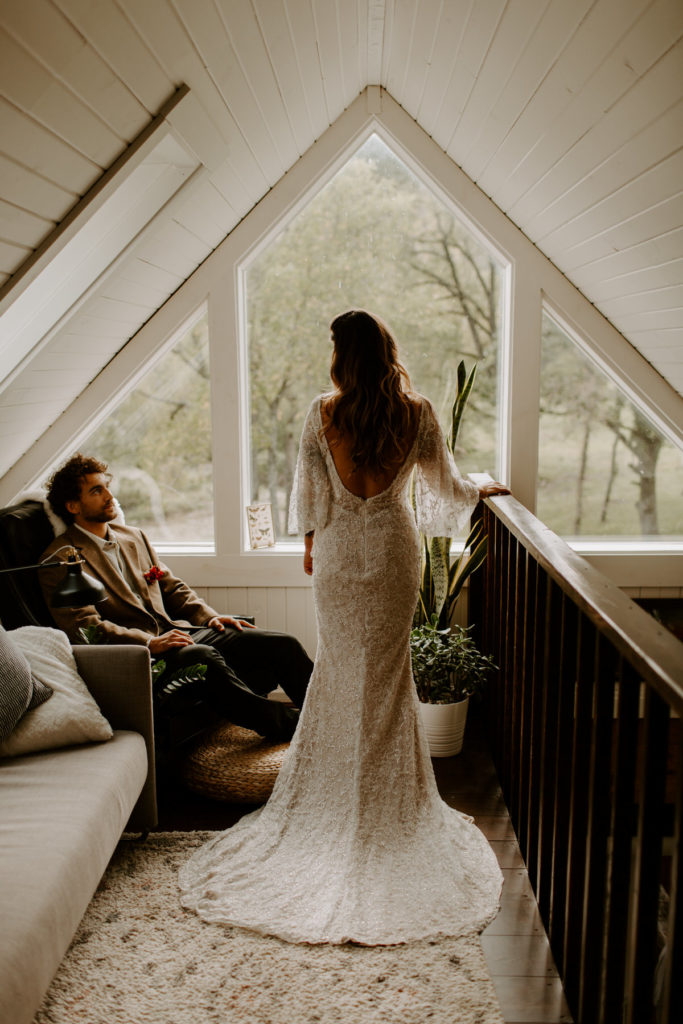 Eloping couple in an A frame Wisconsin cabin photographed by Skyler and Vhan